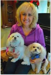 Little Bella (front) was able to alert her owner to her undiagnosed cancer.