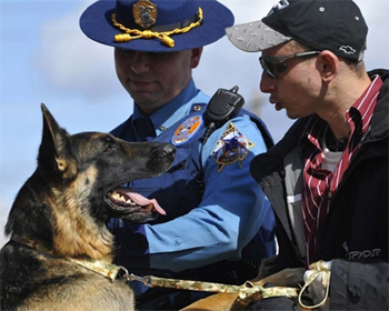 Buddy along with State Trooper Shanigan and his owner Ben Heinrichs.