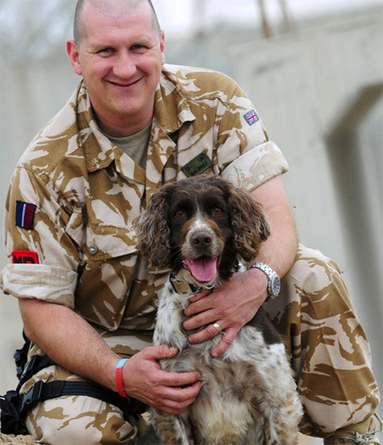 Buster and his owner/handler RAF Police Sergeant Michael Barrow are now enjoying a quieter life. (Photo by Corporal Scott Robertson)