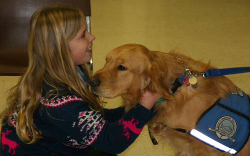 Luther helps a young girl to smile again in Newtown, CT.