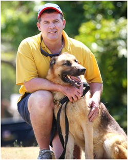 Rocky with handler and dog squad officer Neil Smith.