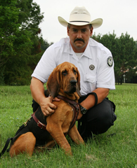 Ranger Kevin Pierce with Annie, the first arson dog to work for the Texas Forst Service.