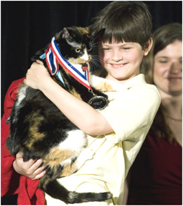 A proud Alex holds Mel-O after she is inducted into the Purina Hall of Fame.